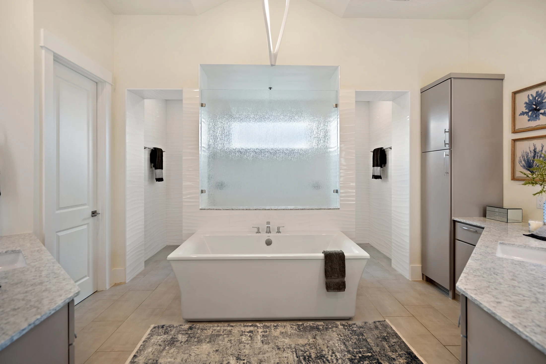 White bathroom with freestanding soaking tub and walk-in shower