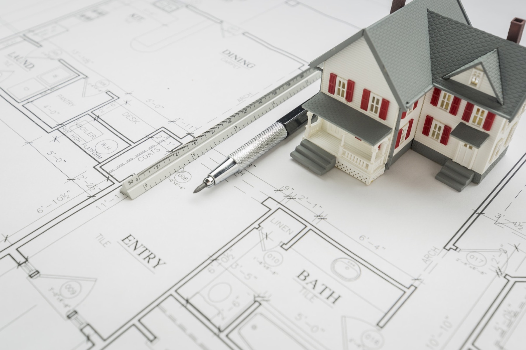 Architectural plans and scale used during custom home design