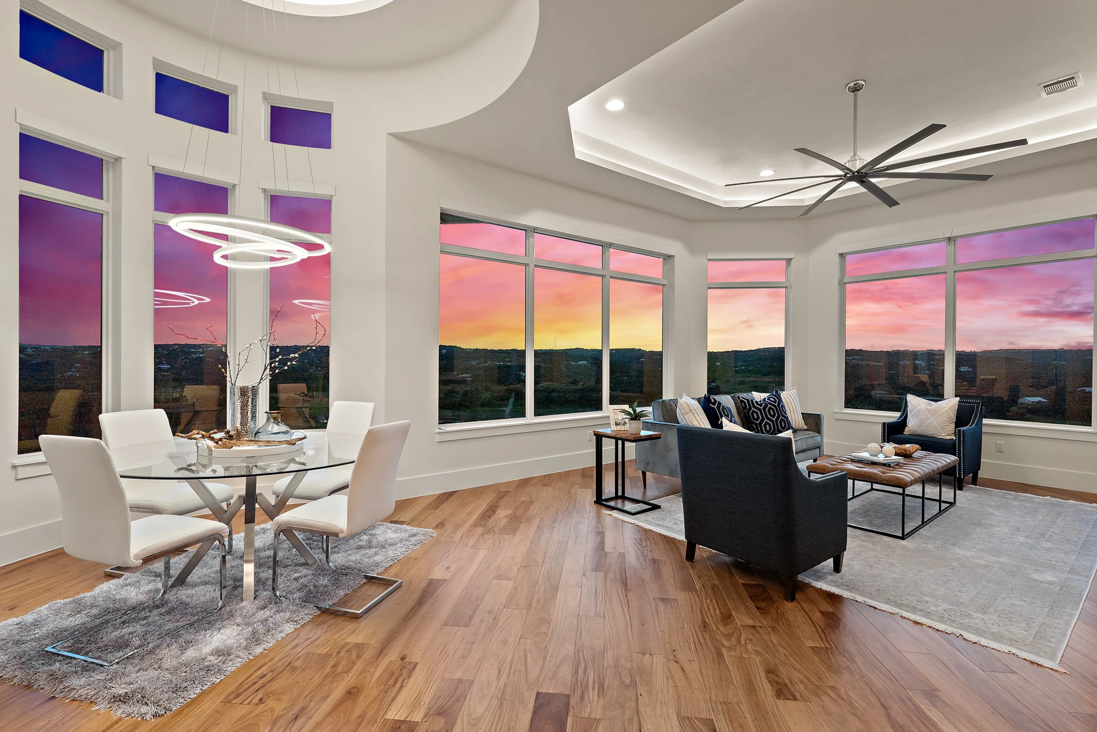 Expansive custom living room opening to a vivid Central Texas sunset